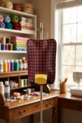 Asthma pump keychain holder displayed in a craft room