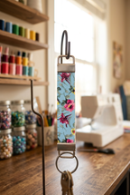 Faux leather wristlet keychain displayed in a craft room